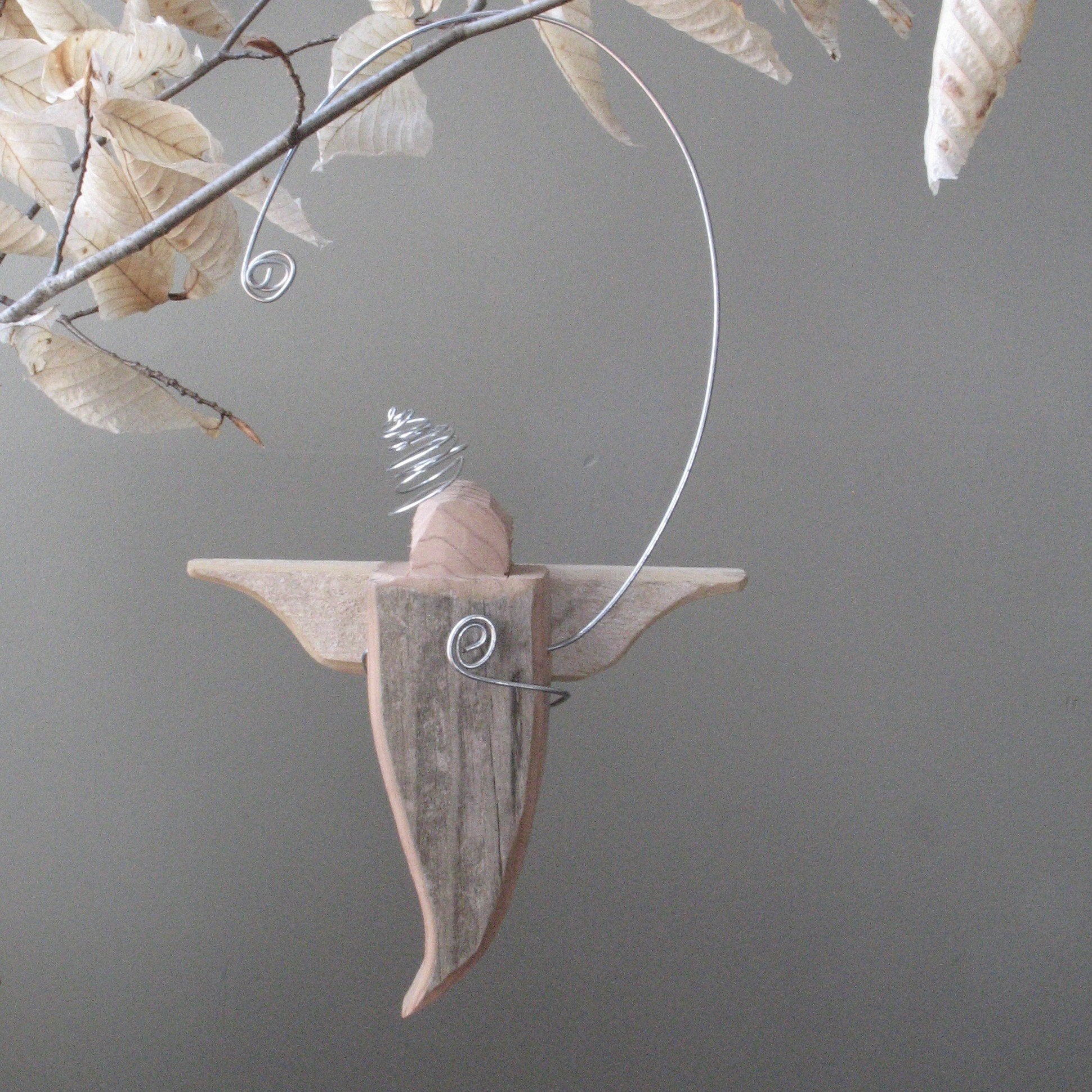 65fcc5d8fd7da02d6a168881_artfully-recycled-adirondack-angel-on-branch_1774742893665.jpg